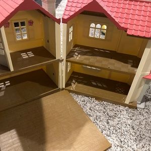 Calico critter house and dolls and furniture